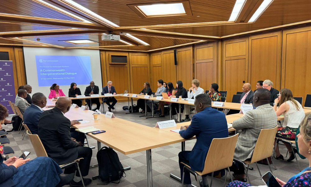 Ministers and youth leaders sit around a table at the intergenerational dialogue on the sidelines of the 37th Commonwealth Health Ministers Meeting